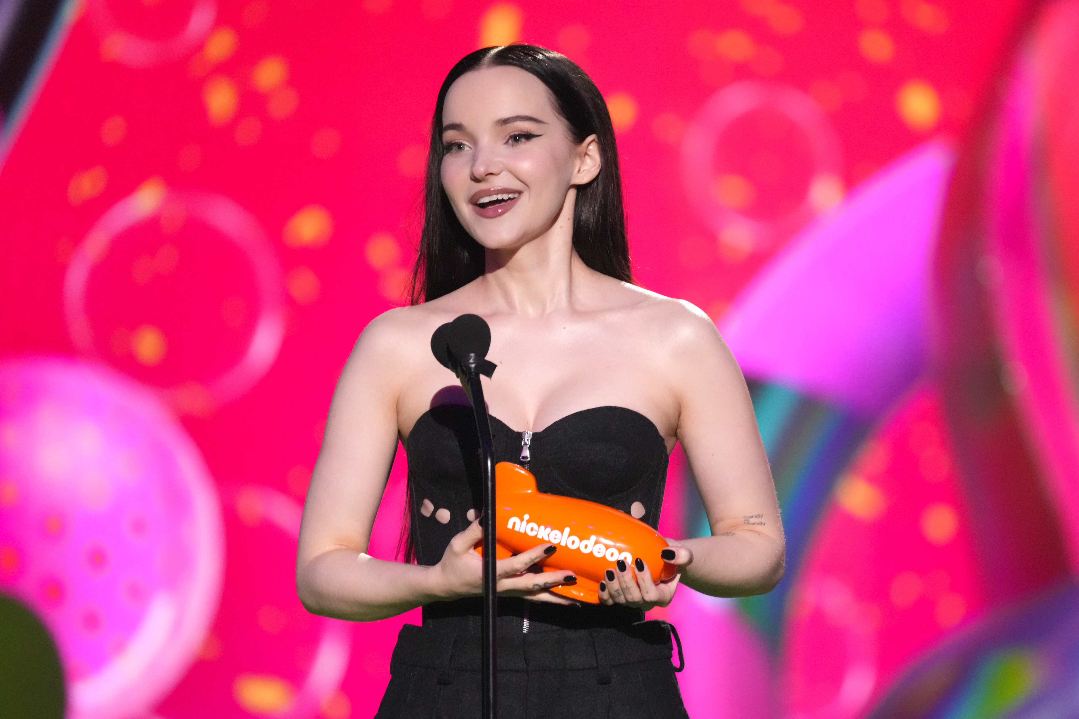Dove Cameron accepts the Favorite Breakout Artist award onstage during the 2023 Nickelodeon Kids' Choice Awards at Microsoft Theater on March 04, 2023 in Los Angeles, California. (Photo by Kevin Mazur/Getty Images for Nickelodeon)